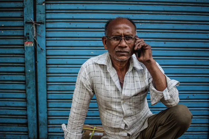 Shop owner in Gujarat taking a reorder call for a consumable product that is about to run out